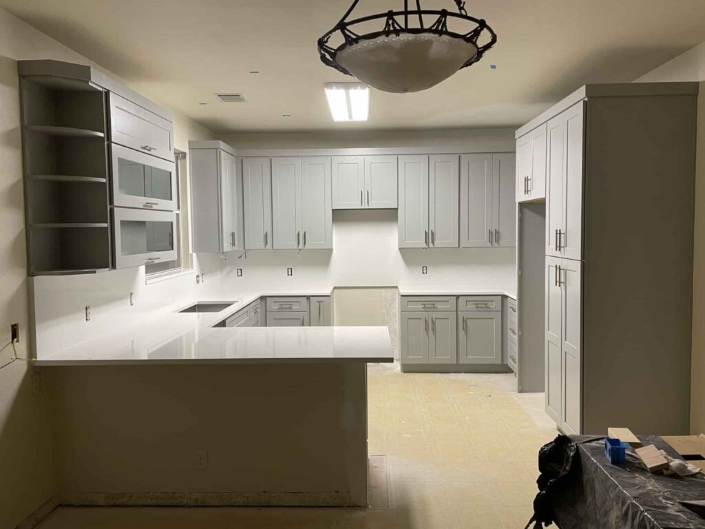 Modern Grey Shaker Cabinet Kitchen with white quartz countertop