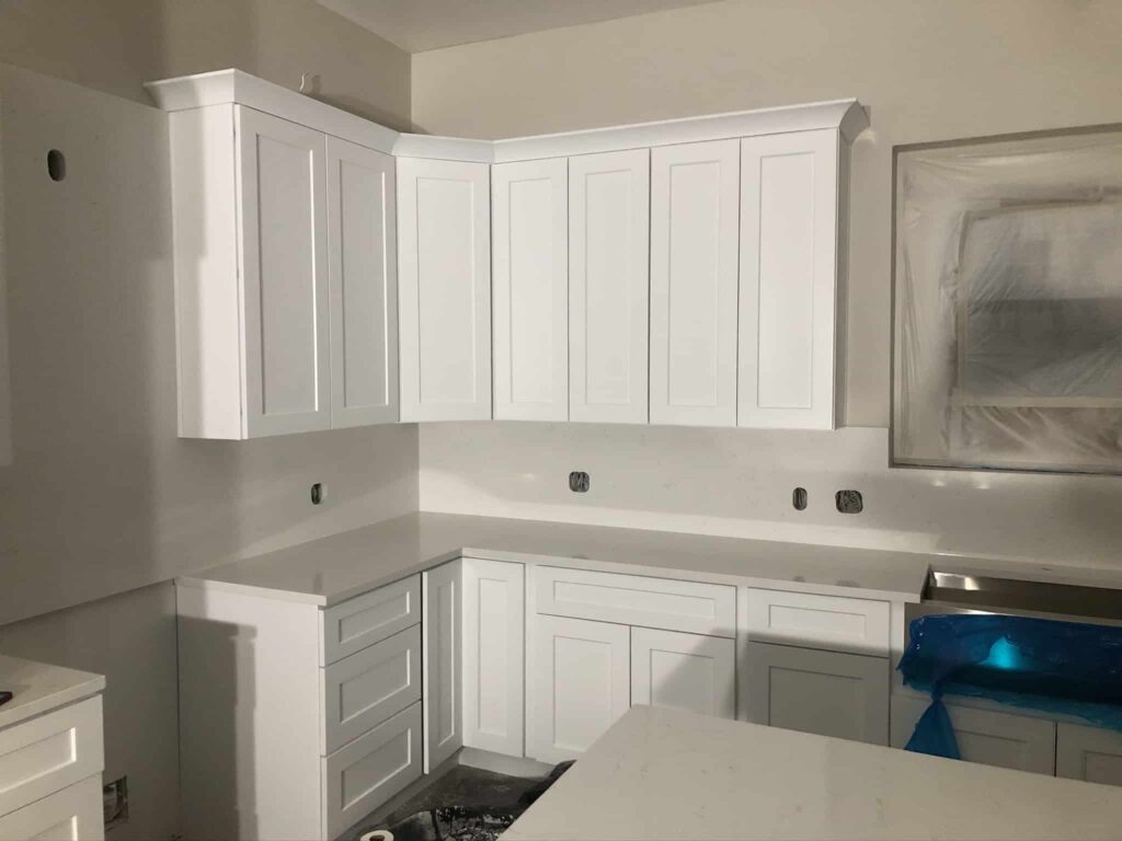 Modern White Shaker Cabinet Kitchen with white quartz countertop